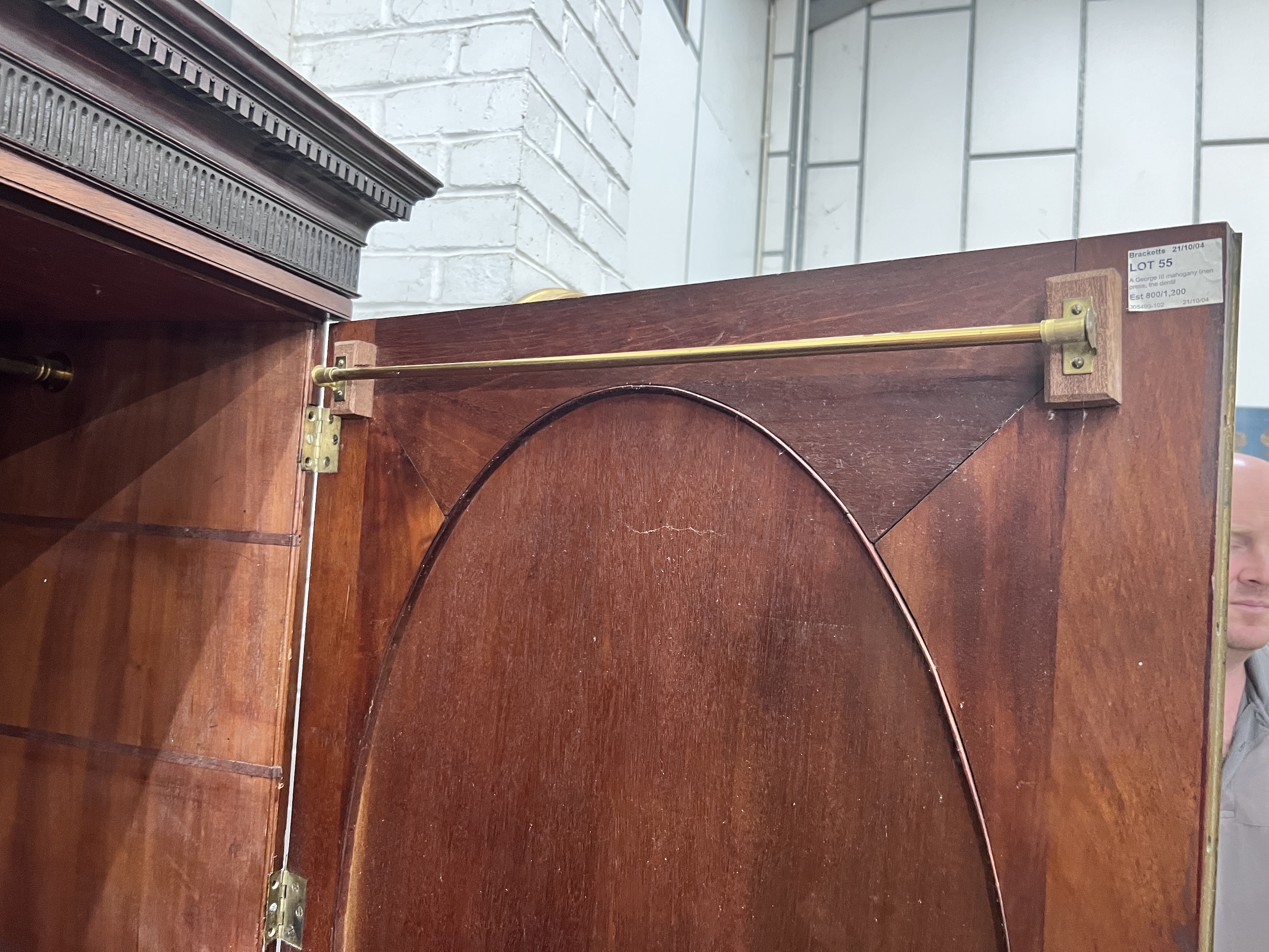 A George III banded mahogany linen press converted to a hanging wardrobe, width 147cm, depth 64cm, height 191cm